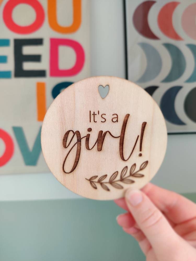 It's a girl wooden disc