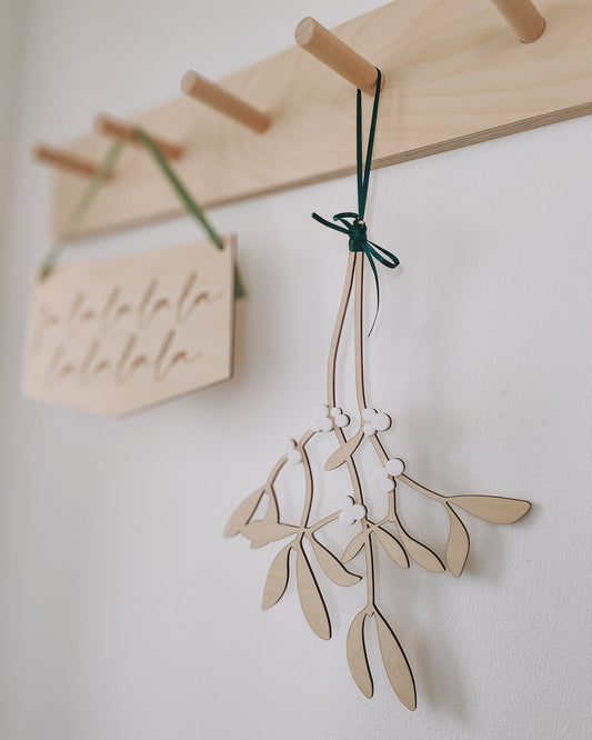 Hanging wooden mistletoe sprig