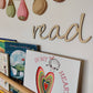 Wooden 'read' wall sign