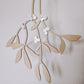 Hanging wooden mistletoe sprig