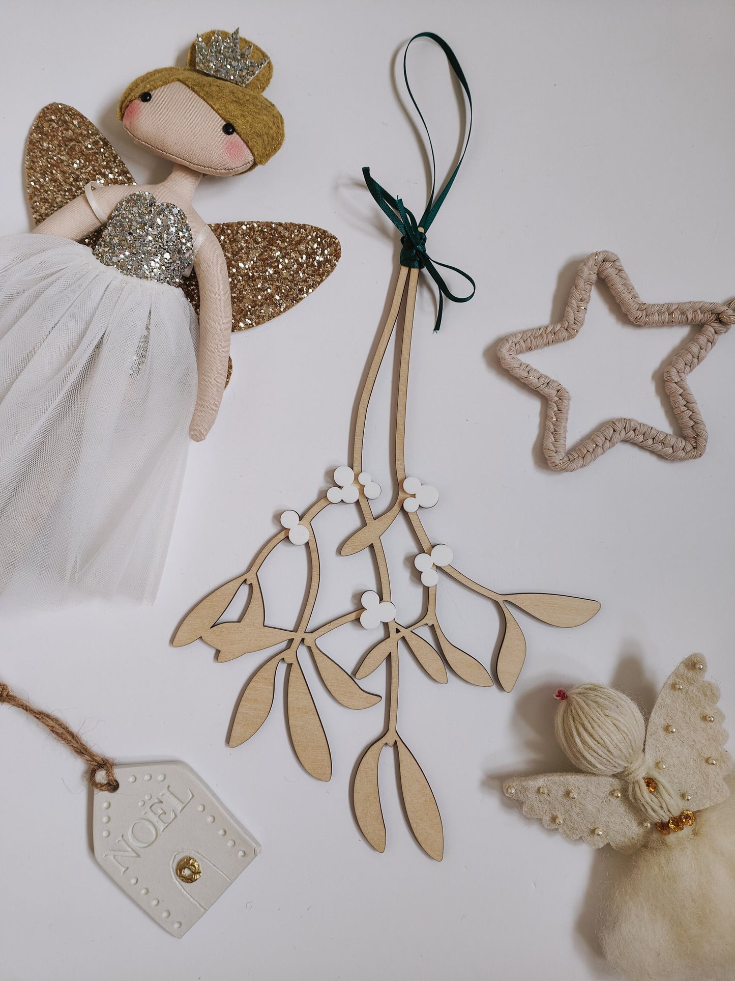 Hanging wooden mistletoe sprig