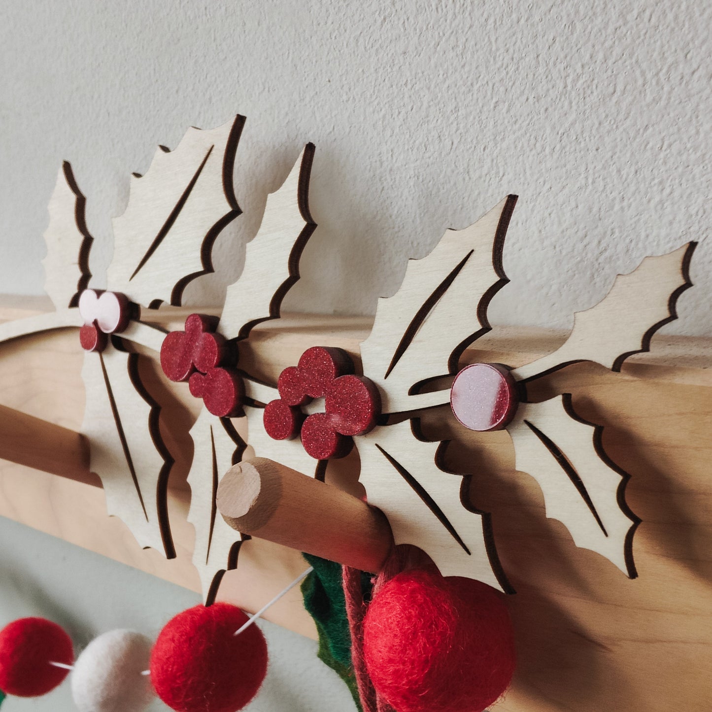 Wooden holly branch