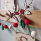 Wooden holly branch