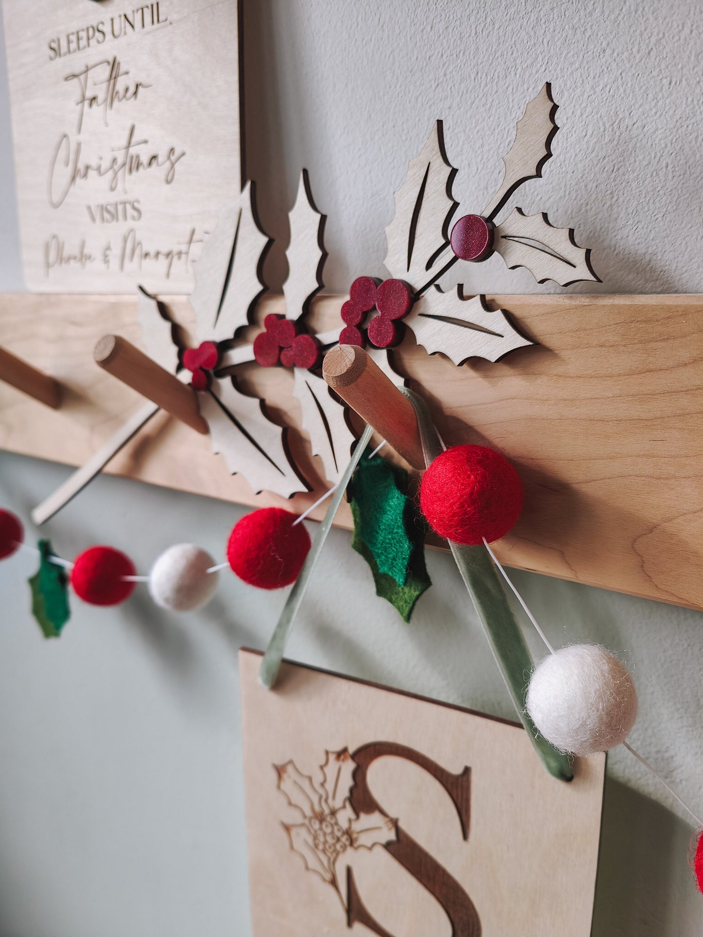 Wooden holly branch